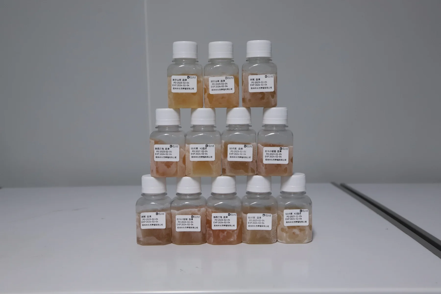 Actual product sample bottles photographed at the facility